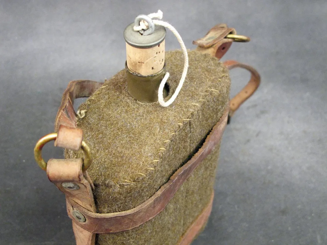 Original British Army Water Bottle in Leather Skeletal Carrier
