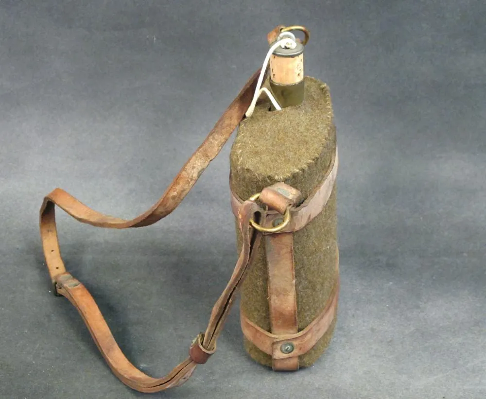 Original British Army Water Bottle in Leather Skeletal Carrier