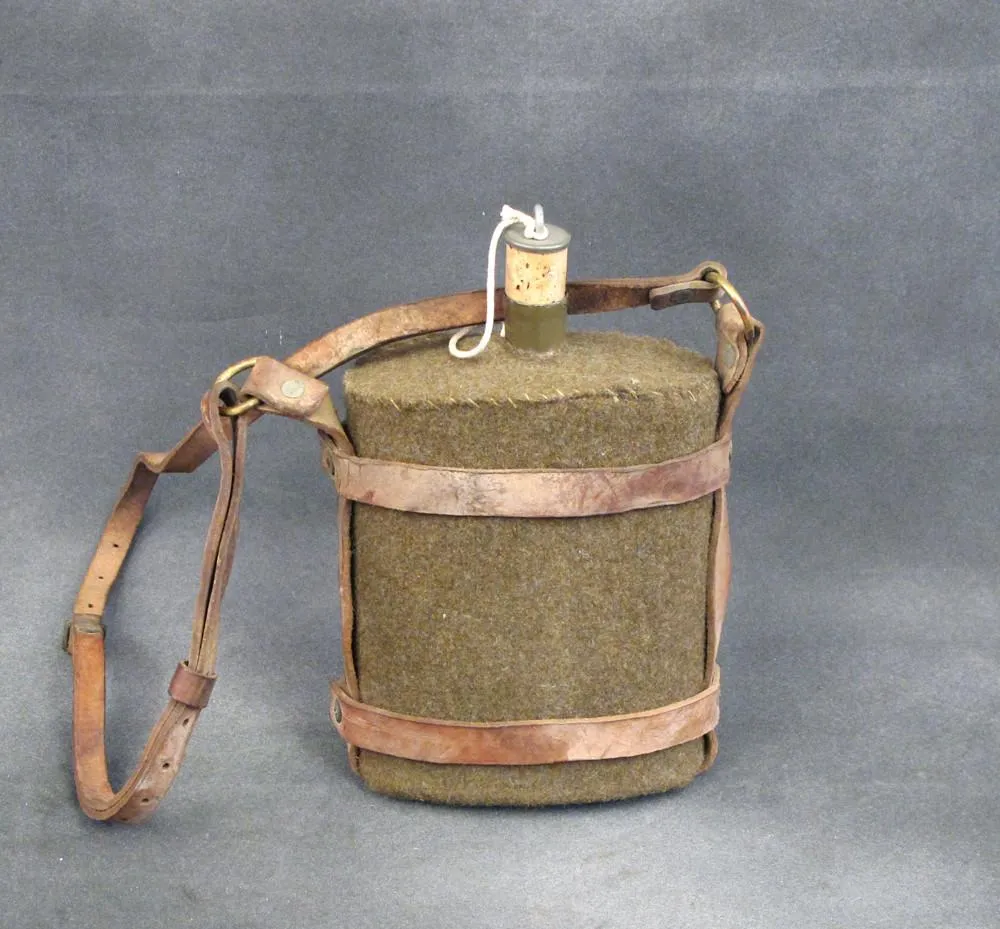 Original British Army Water Bottle in Leather Skeletal Carrier